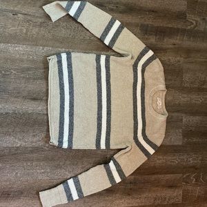 This sweater is very light weight and soft. The brand is pink republic.